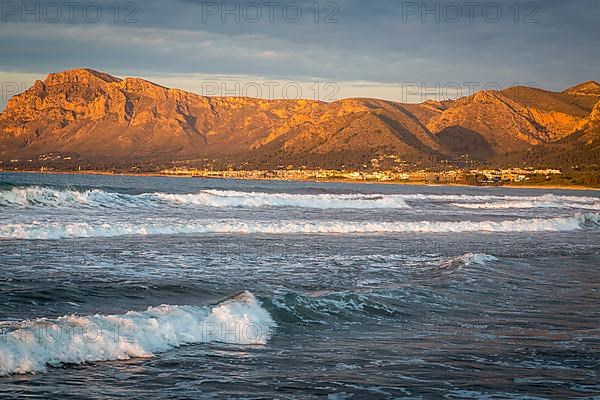 Colonia de Sant Pere in the evening light, waves in front