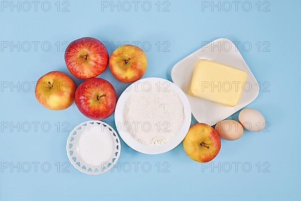 Apple pie baking ingredients with butter, flour