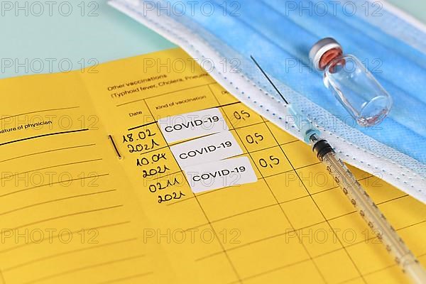 Corina virus booster vaccination concept showing vaccine passport with 3 entries,