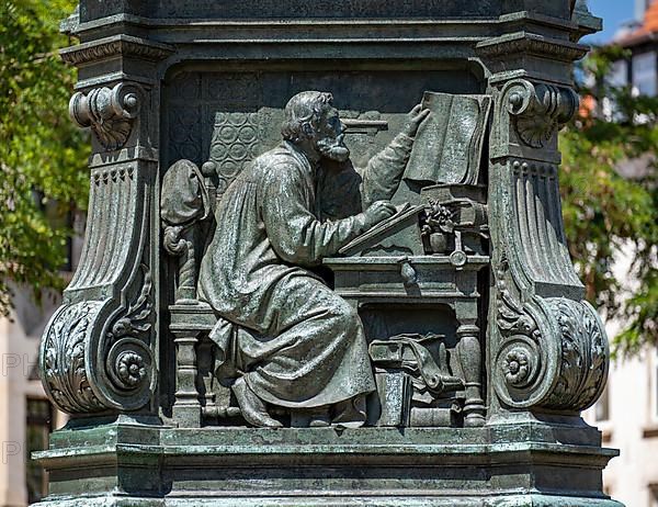 Luther monument by the sculptor Adolf von Donndorf from 1895 on Karlsplatz in Eisenach. The plinth motif shows the reformer Martin Luther,