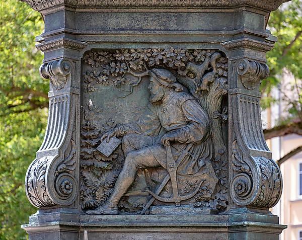 Luther monument by the sculptor Adolf von Donndorf from 1895 on Karlsplatz in Eisenach. The plinth motif shows the reformer Martin Luther,