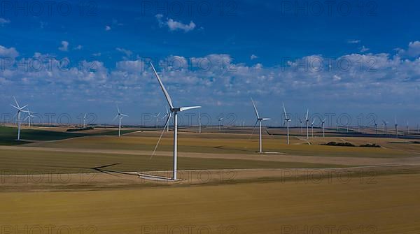 Aerial view wind farm, wind turbines on fields