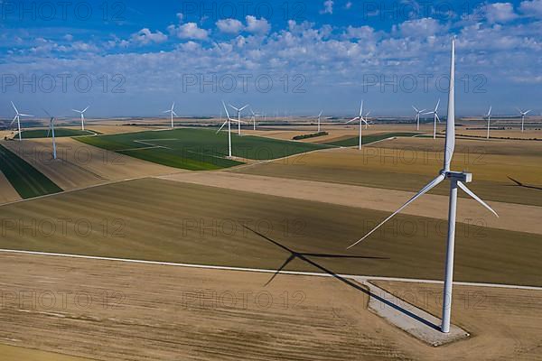 Aerial view wind farm, wind turbines on fields