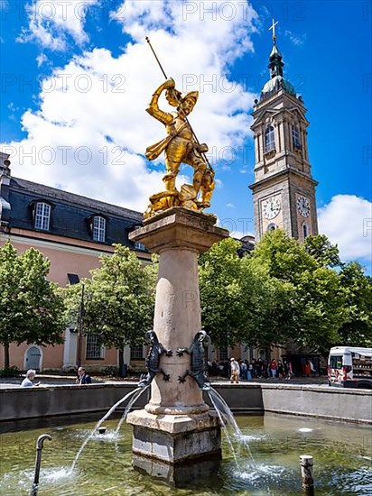 Sculpture of St. George with gilded armour as dragon slayer at St. George's Fountain in front of the Georgenkirche, Eisenach