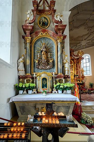 Side altar with figure of Mary and sacrificial candles, St. Verena parish church