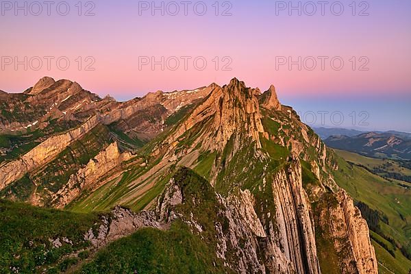 View of the Alpstein mountains in Appenzell, cloudless sky in the morning light