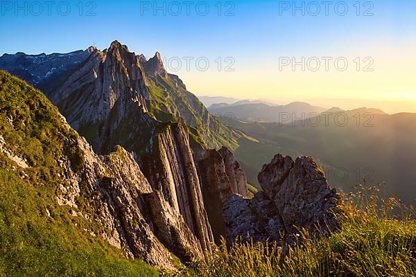 Alpstein mountains with ridge in the evening light, cloudless sky over Appenzellerland