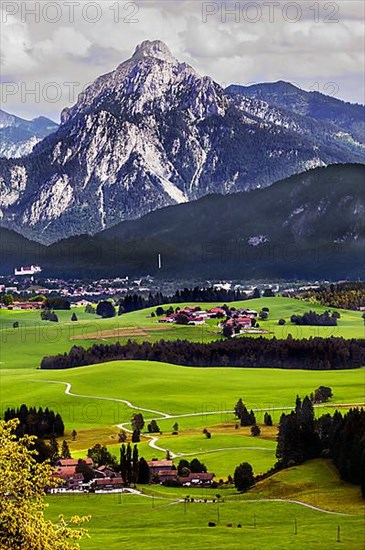 The Saeuling 2047 m and green meadows near Fuessen, Allgaeu