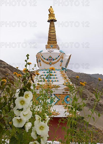 Choerten decorated with flowers and chains, Thiksey Gompa