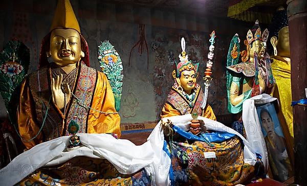 Buddhist lama statues with prayer shawls, Thiksey Monastery or Thikse Gompa