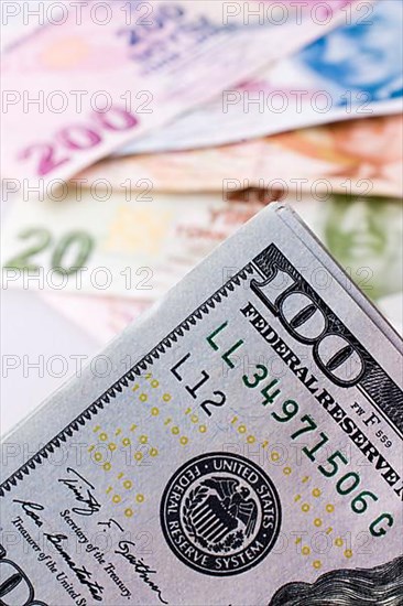 American dollar banknotes and Turksh Lira banknotes side by side on white background,