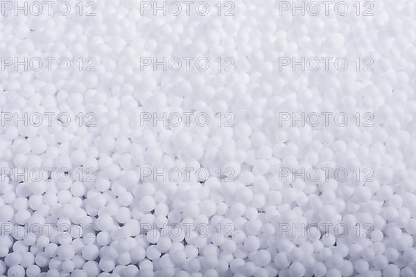 White little polystyrene foam balls as background,