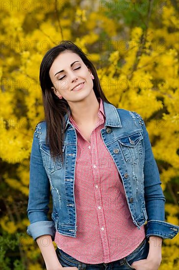 Young woman in front of golden rain,