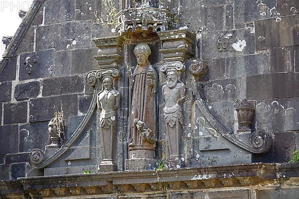 Statue of Pol Aurelien or Pol de Leon above the entrance to the Ossuaire ossuary, Enclos paroissial Eglise Saint-Salomon de La Martyre