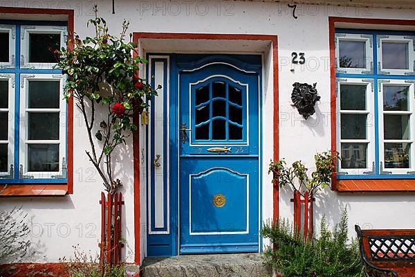 Old fisherman's house from 1796 with decorative wooden door, Historic fishing settlement Holm