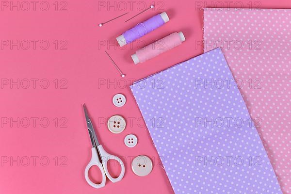 Flat lay with various sewing tools like fabric, scissors