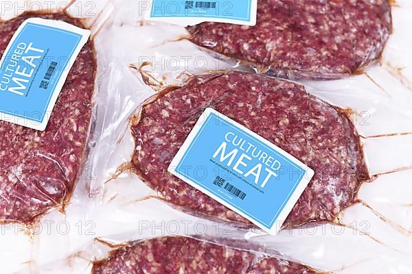 Lab grown cultured meat concept for artificial in vitro cell culture meat production with packed raw meat with made up blue label,