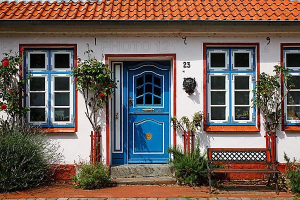 Old fisherman's house from 1796 with decorative wooden door, Historic fishing settlement Holm