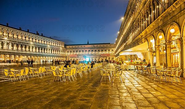 St Mark's Square with the Procuraties and street cafe at dusk, Venice