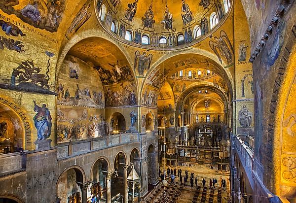 Nave in St Mark's Cathedral with walls full of gold mosaics, Venice