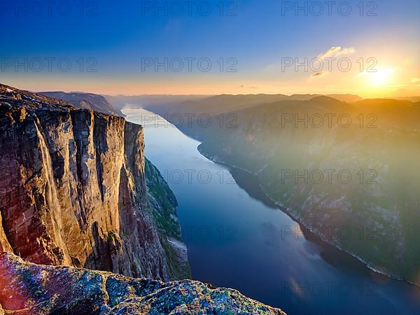 Rock face of Kjerag above the Lysefjord in the evening light, Lyseboten