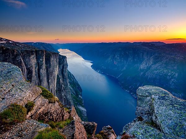 Rock face of Kjerag above Lysefjord at dusk, Lyseboten