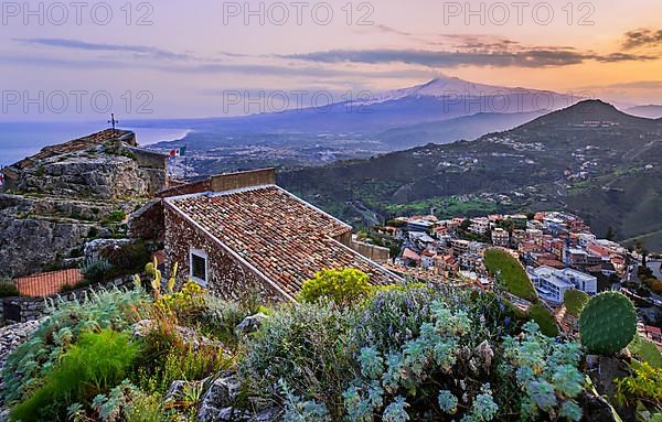 Chapel Madonna della Rocca above the village with Etna 3357m at dusk, Taormina