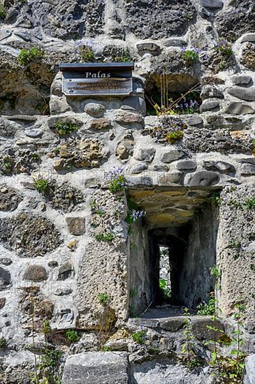 Wall with embrasure and information board, Alt-Trauchburg castle ruins