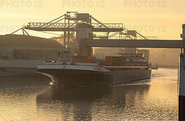 Ship entering the harbour in the evening light, Karlsruhe