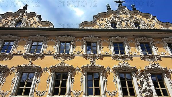 Facade view of the Falkenhaus in the centre of Wuerzburg. is a statue on the old Main bridge in Wuerzburg. Lower Franconia, Franconia