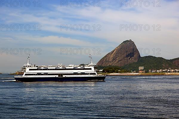 Cargo ship Double Pride in the Baia de Guanbara Bay in the east of Rio de Janeiro, Brazil. Sugar Loaf Mountain in the background