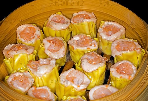 Dim Sum with fish farce and prawns, food photography with black background