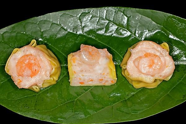 Dim Sum with fish farce and prawns, food photography with black background