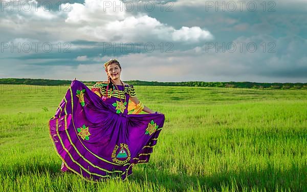 Young Nicaraguan woman in traditional folk costume in the field, Portrait of Nicaraguan girl in traditional folk costume in the field