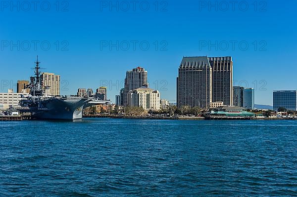 Skyline of San Diego with the USS Midway, California