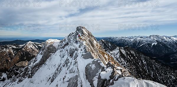 Three mountaineers on a rocky snowy ridge, hiking trail to Ammergauer Hochplatte