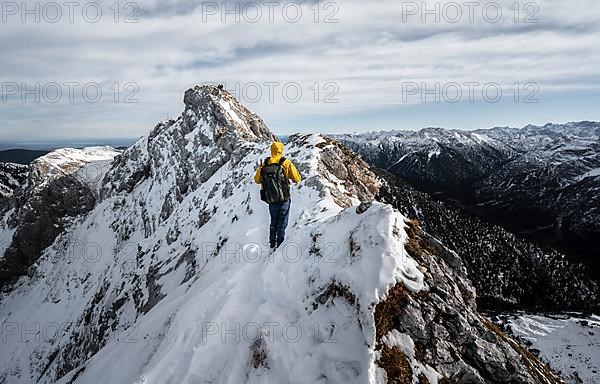 Climbers on a rocky snowy ridge, hiking trail to Ammergauer Hochplatte