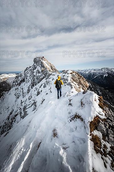 Climbers on a rocky snowy ridge, hiking trail to Ammergauer Hochplatte