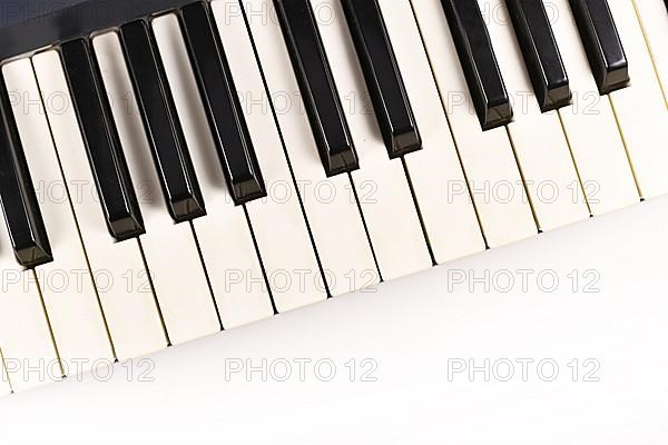 Black and white keys of electric keyboard piano with empty copy space,