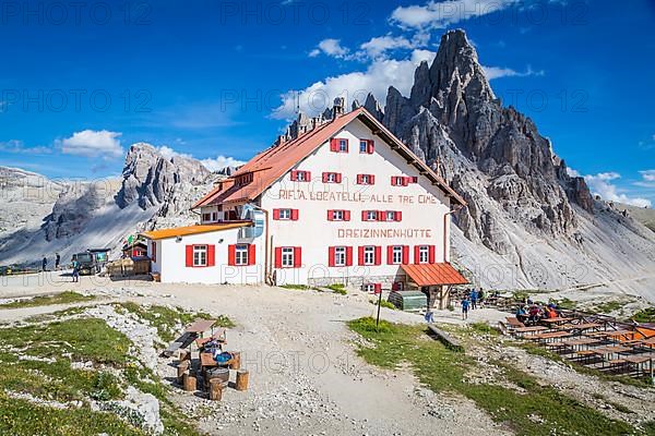 Mountain hut Dreizinnenhuette, behind rock massif Paternkofel