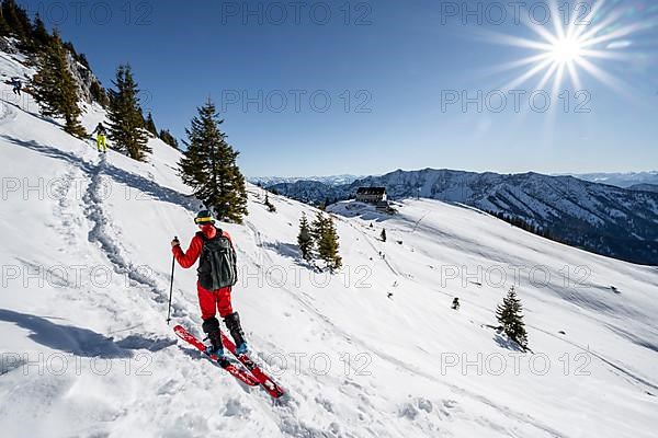 Ski tourers on a ski tour on the Rotwand, behind mountain hut Rotwandhaus