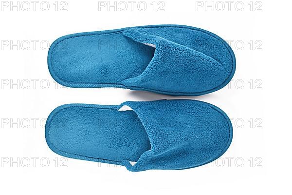 Soft blue home guest slippers on white background,