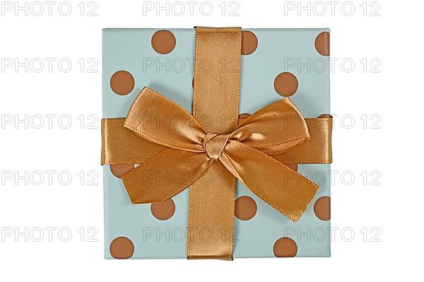 Blue gift box with golden dots and bow isolated on white background,