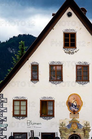 Somewhat dilapidated facade from 1671 with Lueftlmalerei, Hindelang