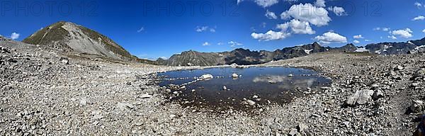 Mountain lake in scree, Fuorcla Radoent
