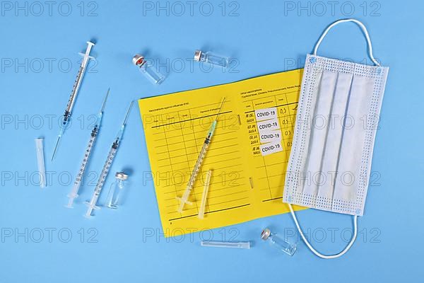 Concept for Corona virus booster vaccination showing vaccine passport with 4 entries,