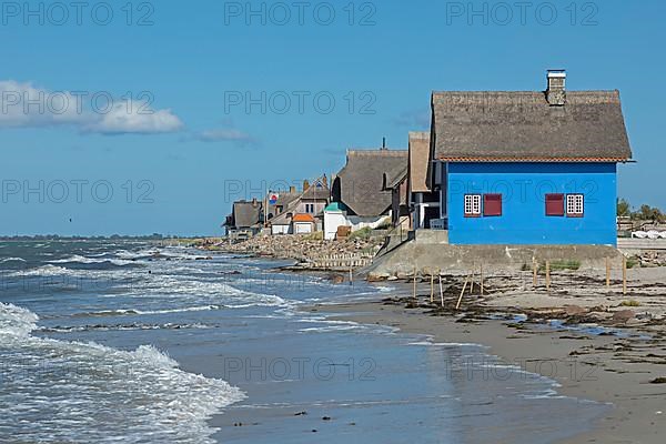 Thatched roof houses on the beach, Graswarder peninsula