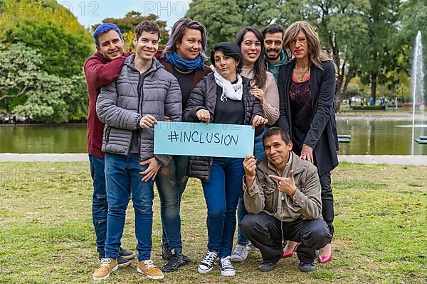 Cheerful queer group holding a message supporting the LGBT community,