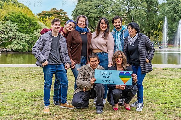 Cheerful queer group holding a message supporting the LGBT community,