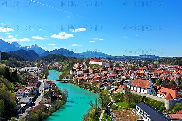 Aerial view of Fuessen with a view of the Lech river, the Benedictine monastery of St. Mang and the high castle. Ostallgaeu Swabia